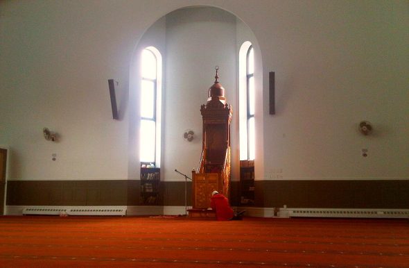 10 - Sitting and Reading Qur'an in front of Mimbar, Ottawa Main Mosque, Jumah Friday August 2 2013