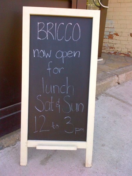 bricco kitchen and wine bar at 3047 dundas street west toronto sidewalk sandwich board in the junction